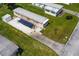 Overhead view of home on a green lot with mature landscaping and concrete driveway at 37302 Carol Ave, Zephyrhills, FL 33542