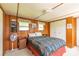 Bedroom with natural light, closet, fan and matching nightstands at 37302 Carol Ave, Zephyrhills, FL 33542