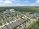 Community aerial view highlighting lake and wooded area with a red pin indicating property location at 3800 Night Star, Odessa, FL 33556