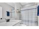 Bathroom showcasing a large mirror, decorative shelf, and a stylish vanity with white marble countertops at 3800 Night Star, Odessa, FL 33556