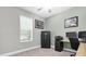 Bedroom with plush carpet, a large window, and an impressive, secure gun safe for protection at 3800 Night Star, Odessa, FL 33556