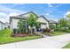 Inviting home exterior featuring a cozy front porch, lush landscaping, and charming curb appeal at 3800 Night Star, Odessa, FL 33556
