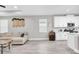 Open-concept living space connecting the living room and kitchen areas at 3800 Night Star, Odessa, FL 33556