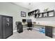 Home office with plush carpet, a large window, and an impressive, secure gun safe for protection at 3800 Night Star, Odessa, FL 33556