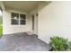 Back patio showcases a beautifully paved sitting area perfect for relaxation and enjoying the outdoors at 3800 Night Star, Odessa, FL 33556