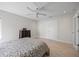 Light and airy bedroom with ceiling fan, closet, and chest of drawers at 3956 Versailles Dr, Tampa, FL 33634