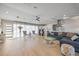 Spacious living room featuring modern decor, light wood floors, and plenty of natural light at 3956 Versailles Dr, Tampa, FL 33634