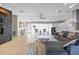 Open-concept living room featuring a fireplace, sheer curtains, and lots of natural light at 3956 Versailles Dr, Tampa, FL 33634