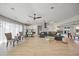 Expansive living space with an open floor plan, light wood floors, and neutral decor at 3956 Versailles Dr, Tampa, FL 33634