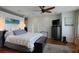 Bright main bedroom featuring hardwood floors, recessed lighting, ceiling fan, and modern decor at 3956 Versailles Dr, Tampa, FL 33634