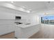 A modern kitchen featuring stainless steel appliances, a large island, and an open-concept design at 400 150Th Ave # 205, Madeira Beach, FL 33708