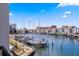 Stunning waterfront view with boats docked, showcasing a picturesque harbor and coastal community at 400 150Th Ave # 205, Madeira Beach, FL 33708