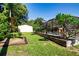 Expansive backyard featuring a pool with enclosure, a storage shed, and a verdant lawn at 4205 Helene Pl, Valrico, FL 33594