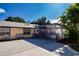 Backyard featuring an enclosed patio, a seating area, and lush tropical landscaping at 4205 Helene Pl, Valrico, FL 33594
