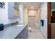 Updated bathroom features a new vanity, flooring, fixtures, toilet, and shower with a glass door at 4205 Helene Pl, Valrico, FL 33594