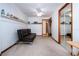 Inviting bedroom with a wall shelf, mirrored closet, and a black futon sofa for relaxing at 4205 Helene Pl, Valrico, FL 33594