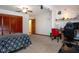 Bright bedroom with a decorations on the wall, adjacent closet, ceiling fan, carpet floor, and a natural light at 4205 Helene Pl, Valrico, FL 33594