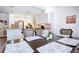 Dining area with table setting and seamless flow into the kitchen area at 4205 Helene Pl, Valrico, FL 33594