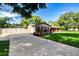 Beautiful home with well-maintained lawn, long driveway leading to garage, and vibrant landscaping at 4205 Helene Pl, Valrico, FL 33594
