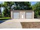 Large detached garage offers ample parking and storage space, plus additional workspace at 4205 Helene Pl, Valrico, FL 33594