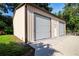 Detached garage with multiple bays and a side entry, perfect for vehicle storage at 4205 Helene Pl, Valrico, FL 33594