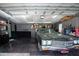 Spacious garage features epoxy floors, storage, and a classic green Chevy SS at 4205 Helene Pl, Valrico, FL 33594