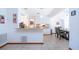 Bright kitchen overlooking the dining room, featuring white cabinets and granite countertops at 4205 Helene Pl, Valrico, FL 33594