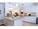 Bright kitchen featuring white cabinets, granite countertops, stainless steel appliances, and tile floors at 4205 Helene Pl, Valrico, FL 33594