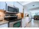 Gleaming kitchen features granite countertops, stainless steel appliances, and tiled floor at 4205 Helene Pl, Valrico, FL 33594