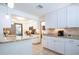 Well-lit kitchen featuring white cabinetry, granite counters, and stainless steel appliances at 4205 Helene Pl, Valrico, FL 33594