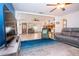 Spacious living room featuring tile floors, a stone fireplace, and ample seating at 4205 Helene Pl, Valrico, FL 33594