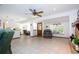 Living room featuring tile floors, a cozy dining area, and natural light at 4205 Helene Pl, Valrico, FL 33594