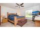 Relaxing main bedroom features a ceiling fan, carpeted floors, and window with natural light at 4205 Helene Pl, Valrico, FL 33594