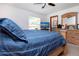 Cozy main bedroom with a ceiling fan, carpeted floors, and TV at 4205 Helene Pl, Valrico, FL 33594