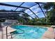 Relaxing screened pool with clear blue water and ample lounge seating at 4205 Helene Pl, Valrico, FL 33594