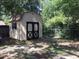 Well-maintained shed provides extra storage space in this fenced backyard at 4205 Helene Pl, Valrico, FL 33594