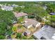 A bird's-eye view of the property showcasing its architectural style and tree coverage at 4417 W El Prado Blvd, Tampa, FL 33629