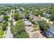 Lush neighborhood featuring a variety of homes, mature trees, and a view of the water in the distance at 4417 W El Prado Blvd, Tampa, FL 33629