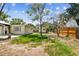 Backyard featuring a shed, trees, and lawn at 4417 W El Prado Blvd, Tampa, FL 33629