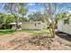 Backyard showing a covered patio, shed, and partial grass coverage at 4417 W El Prado Blvd, Tampa, FL 33629