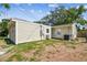 Exterior view of the home showing siding and greenery at 4417 W El Prado Blvd, Tampa, FL 33629