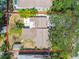 A top-down view showing the property outlined in red, revealing its structure and the trees around it at 4417 W El Prado Blvd, Tampa, FL 33629