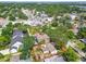 An aerial view showing the property outlined in red, surrounded by mature trees and neighboring buildings at 4417 W El Prado Blvd, Tampa, FL 33629
