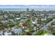 Stunning aerial view of the waterfront home in a coastal community, with a swimming pool and canal access at 451 Avenida De Mayo, Sarasota, FL 34242