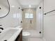 Modern bathroom featuring glass shower, decorative tiles, and stylish fixtures at 451 Avenida De Mayo, Sarasota, FL 34242