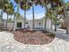 Charming single-story home features a well-manicured front yard with mature landscaping and a brick paver walkway at 451 Avenida De Mayo, Sarasota, FL 34242
