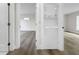 Convenient laundry area with stacked washer and dryer between two bright rooms at 451 Avenida De Mayo, Sarasota, FL 34242