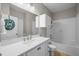 Bright bathroom features a vanity with a large mirror and a shower-tub combination at 5000 Culbreath Key Way # 1-112, Tampa, FL 33611