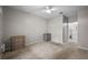 This bedroom offers neutral walls with carpet, ceiling fan and a view to the ensuite bathroom at 5000 Culbreath Key Way # 1-112, Tampa, FL 33611