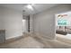 Bedroom with neutral walls, carpet, ceiling fan and a view to the living room at 5000 Culbreath Key Way # 1-112, Tampa, FL 33611